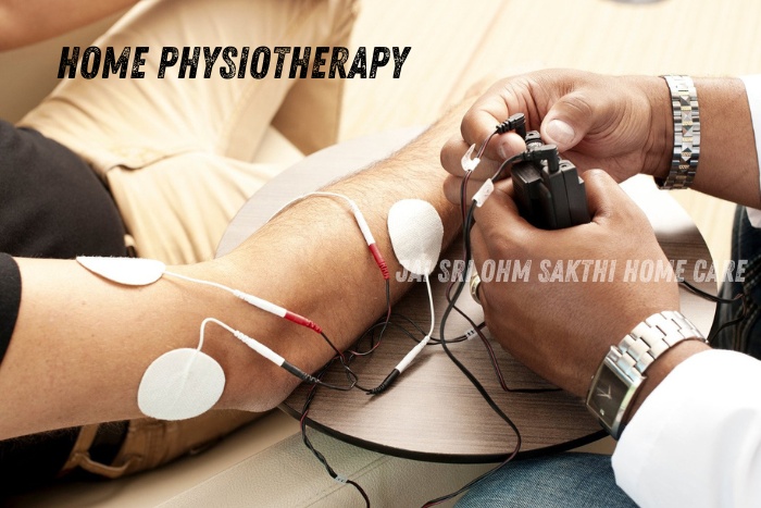Home physiotherapy session in progress with a professional therapist using electrotherapy equipment on a patient's arm in Coimbatore, showcasing Jai Sri Ohm Sakthi Home Care's specialized in-home treatment capabilities