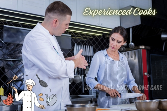 Professional chef instructing a woman in a kitchen, highlighting the experienced cooks available through Jai Sri Ohm Sakthi Home Care in Coimbatore for exceptional home cooking services