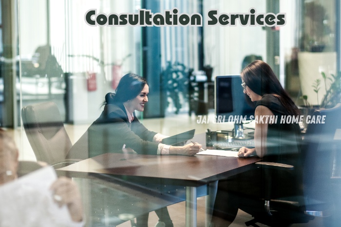 Two women engaged in a consultation meeting in a modern office setting, representing the professional consultation services offered by Jai Sri Ohm Sakthi Home Care in Coimbatore. The friendly interaction highlights the importance of personalized care planning and support for families seeking home nursing solutions.