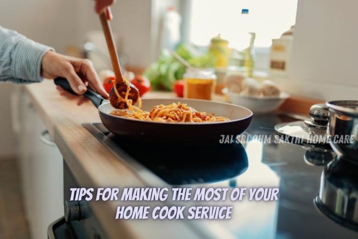 A close-up of a person cooking pasta in a frying pan, with fresh ingredients visible in the background. This image represents tips for making the most of home cook services provided by Jai Sri Ohm Sakthi Home Care in Coimbatore